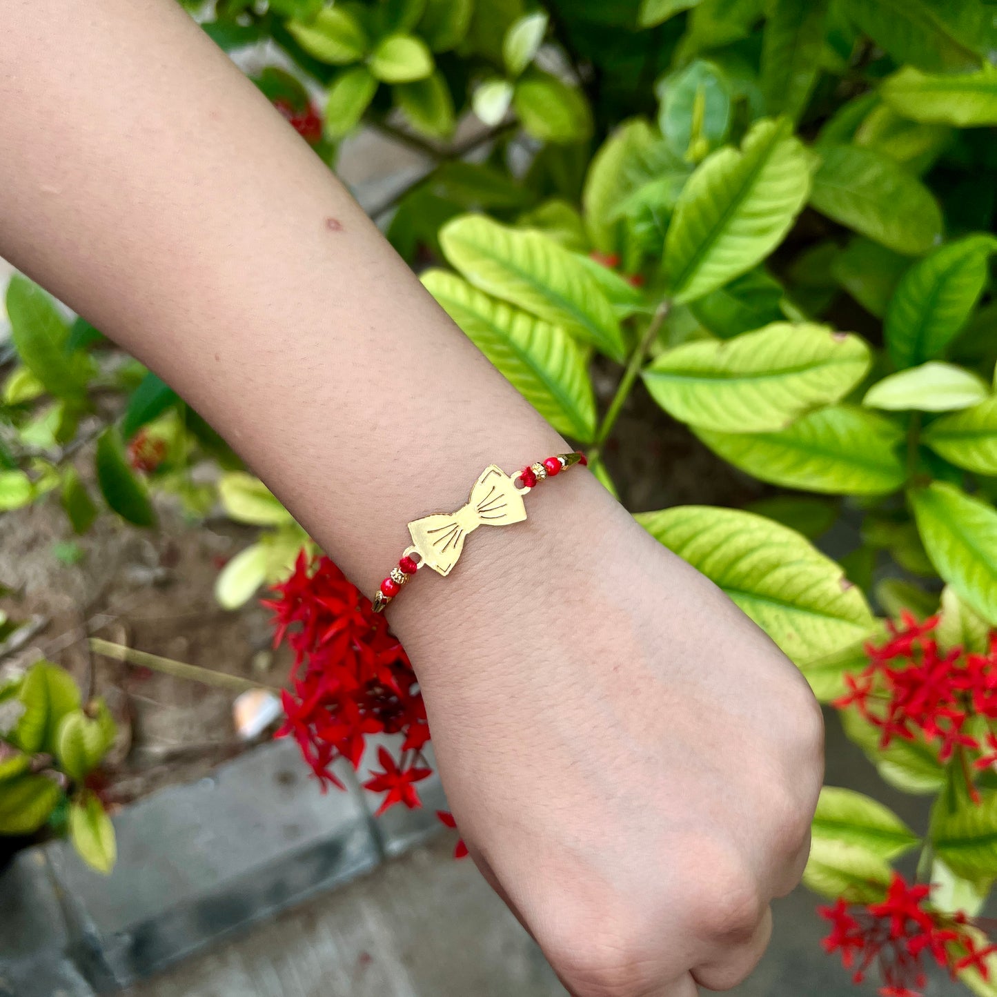 Golden Bow Rakhi – Mirror Acrylic Rakhi for Bhai