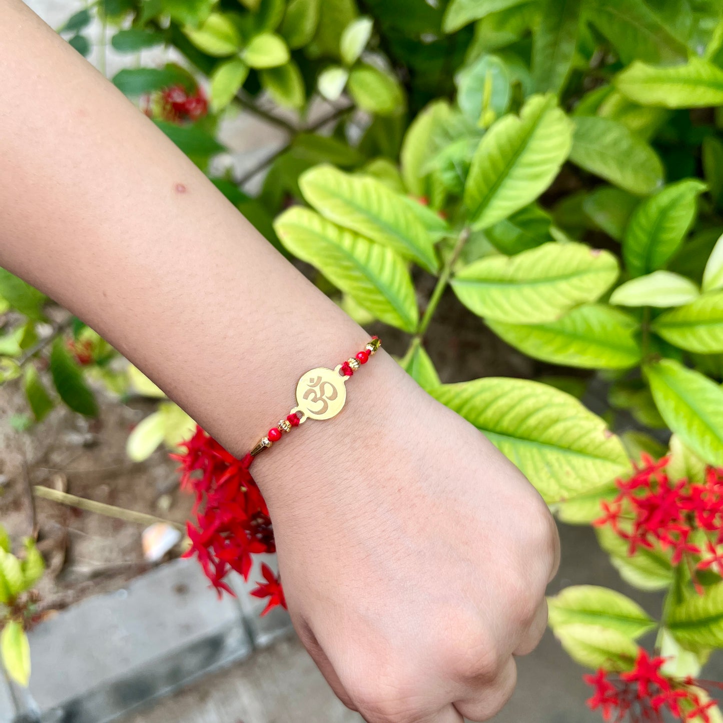 Golden Om Rakhi – Mirror Acrylic Rakhi for Bhai
