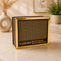 The Case Flick ₹1,00,000 Savings Challenge Piggy Bank in dark coffee MDF with gold acrylic border - front view